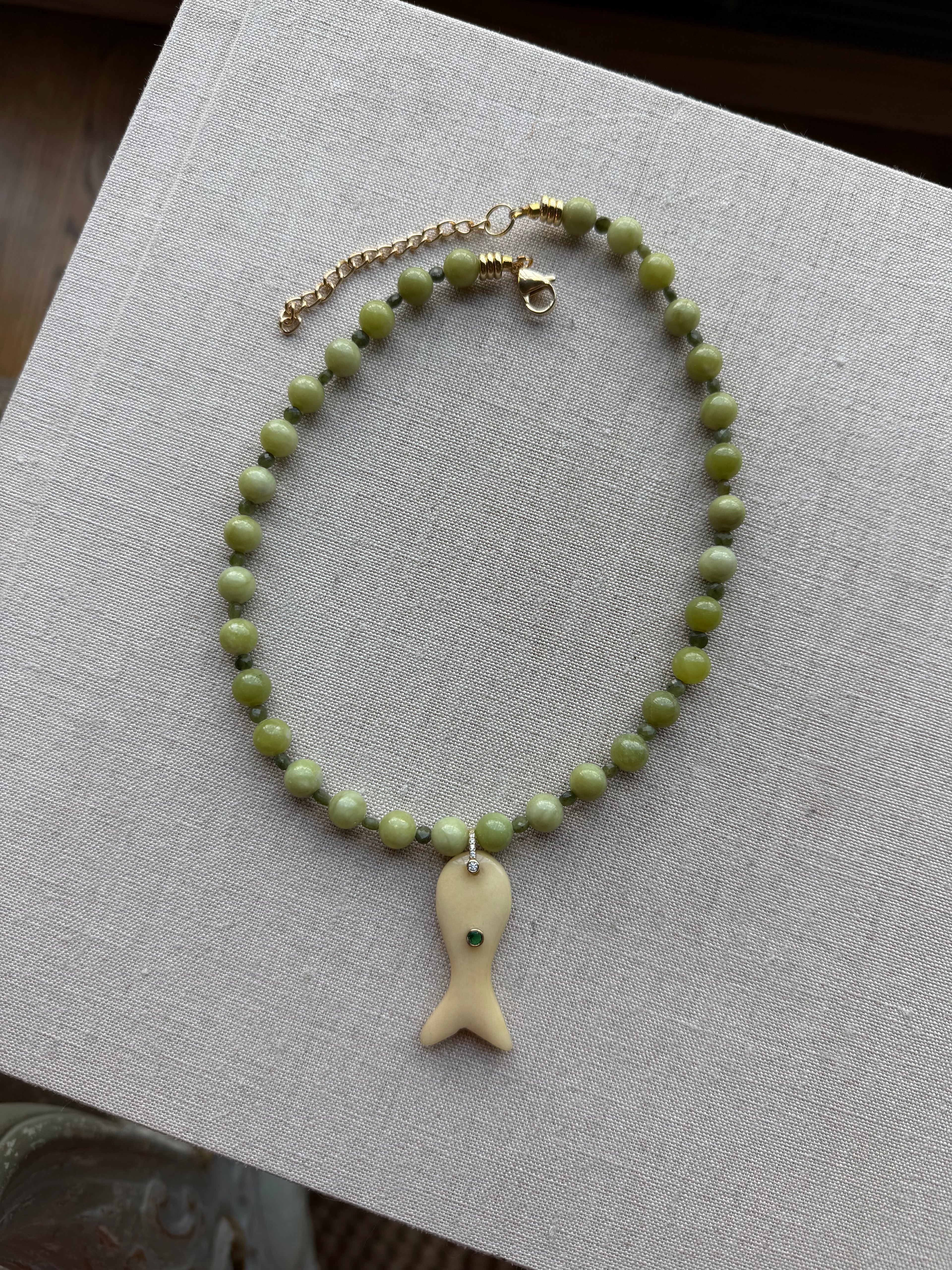 green fish necklace